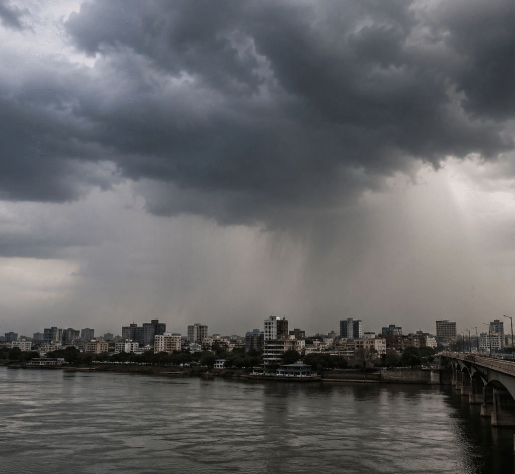 Dark monsoon clouds over Gujarat as heavy rain lashes the city under an IMD Red Alert, with reduced visibility and stormy weather conditions.