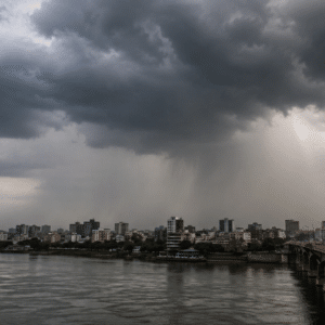 Dark monsoon clouds over Gujarat as heavy rain lashes the city under an IMD Red Alert, with reduced visibility and stormy weather conditions.